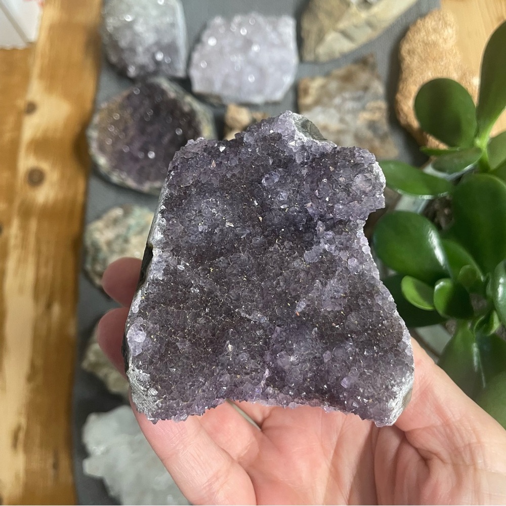 Amethyst crystal cut base display. Dark saturated purple
